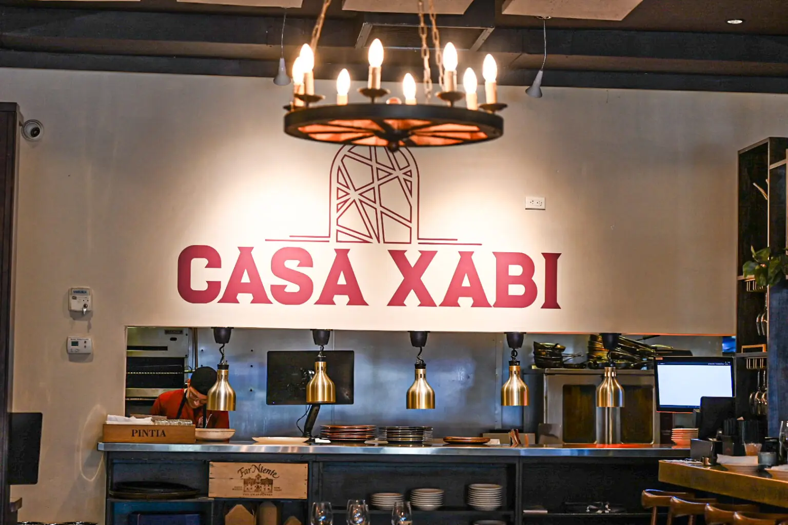 The Casa Xabi dining room and illuminated sign