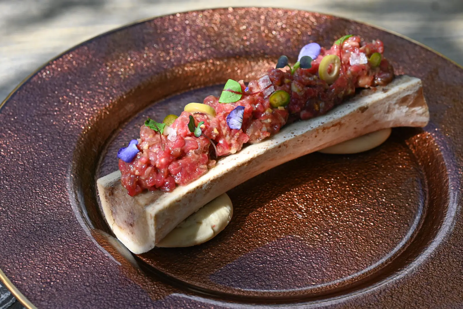 Tartare served over roasted bone marrow